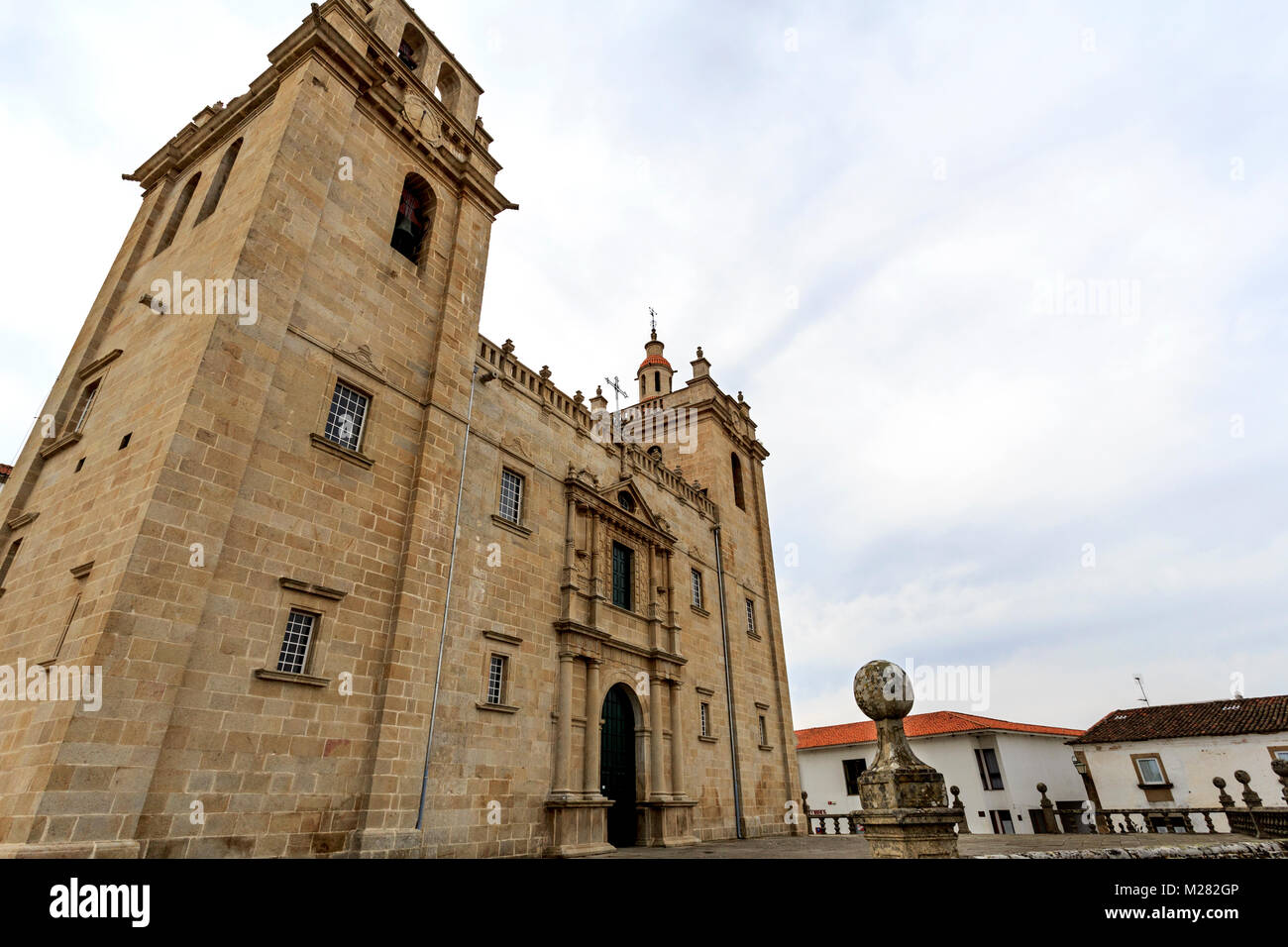 Catholic cathedral of mannerist style with an austere facade flanked by imposed bell towers on each side and surmounted by rail, in Miranda do Douro,  Stock Photo