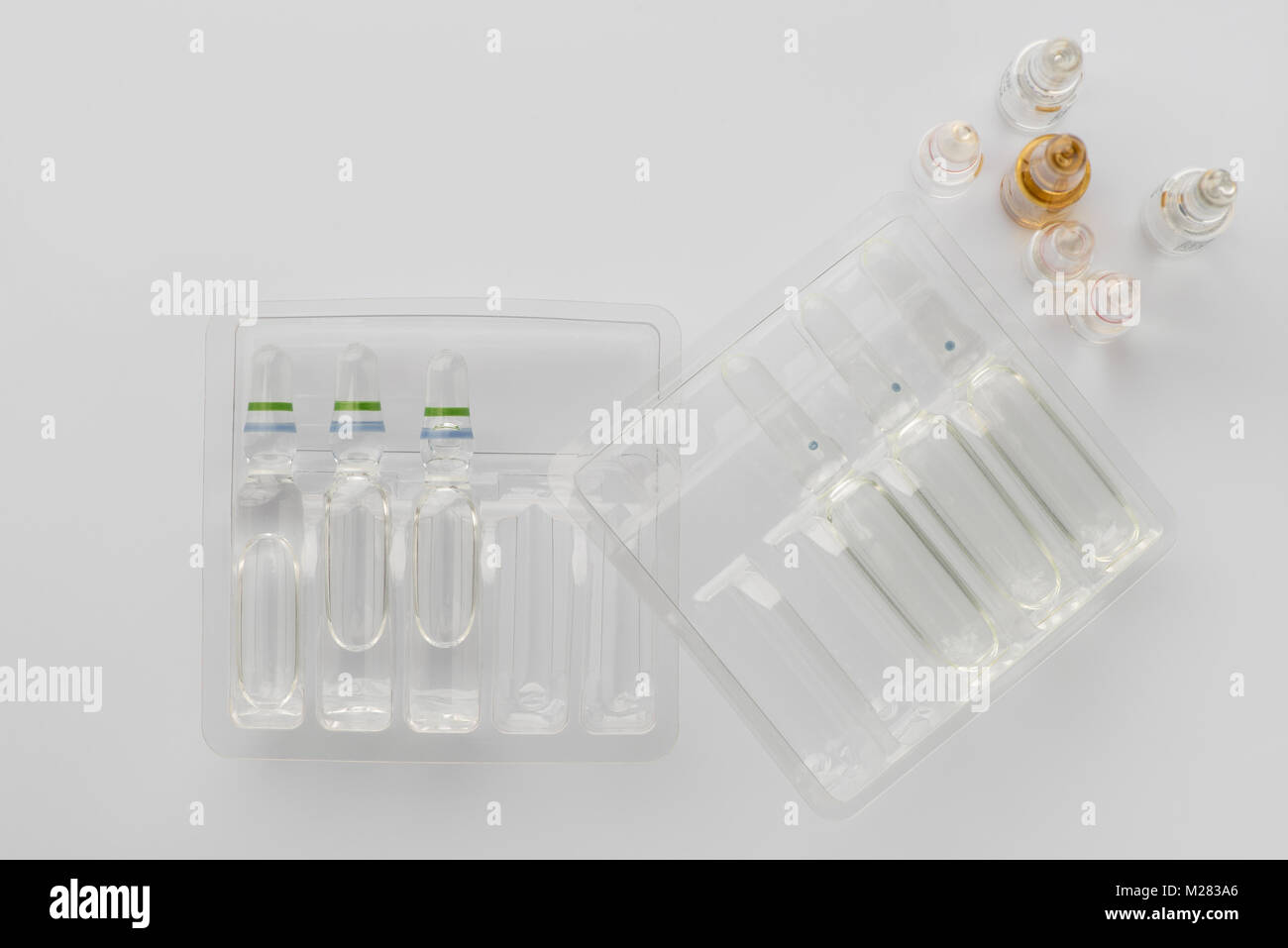 Medical vials with liquid for injection in plastic containers on a ...