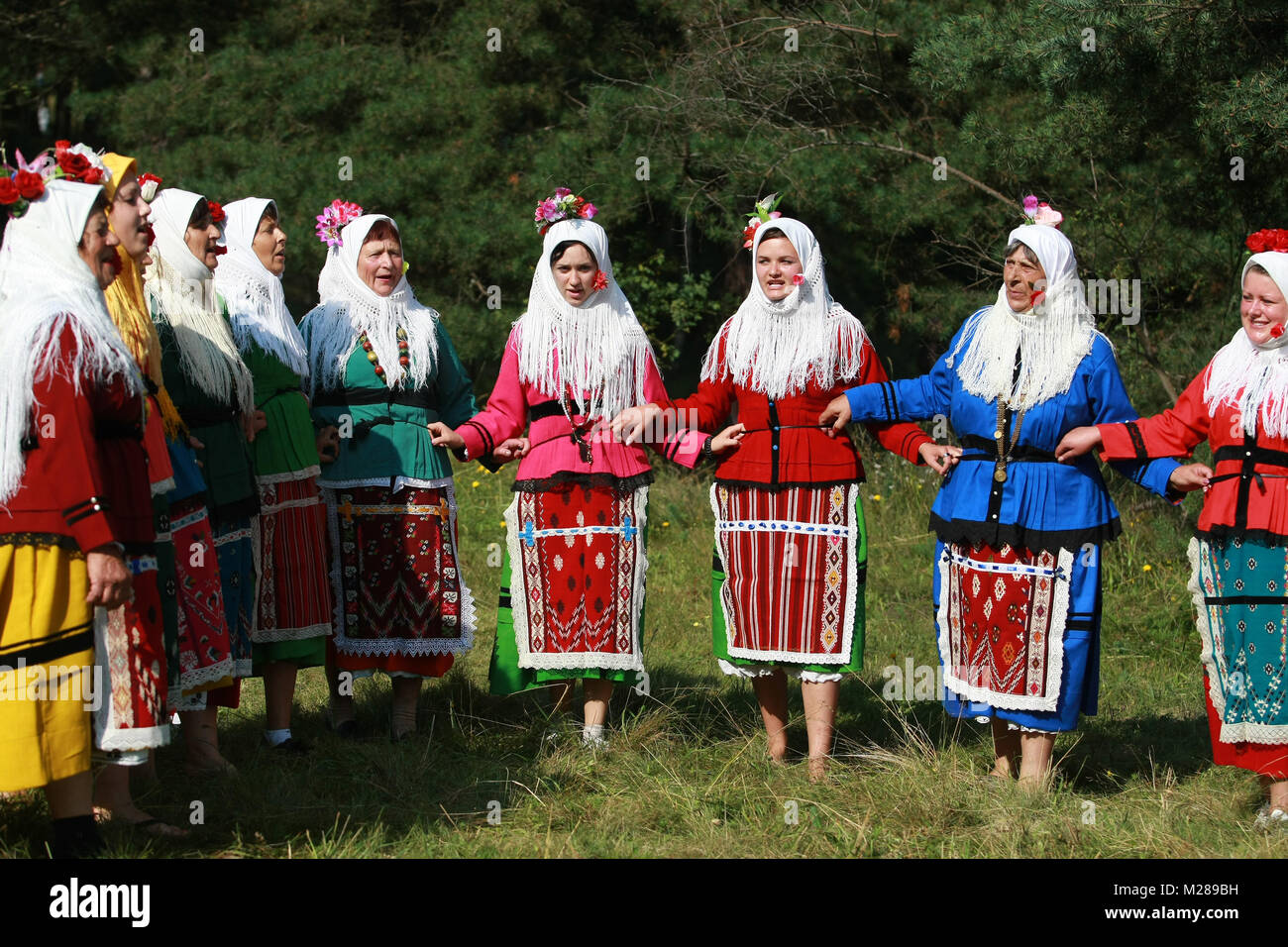 People in traditional folk costume of The National Folklore Fair in ...