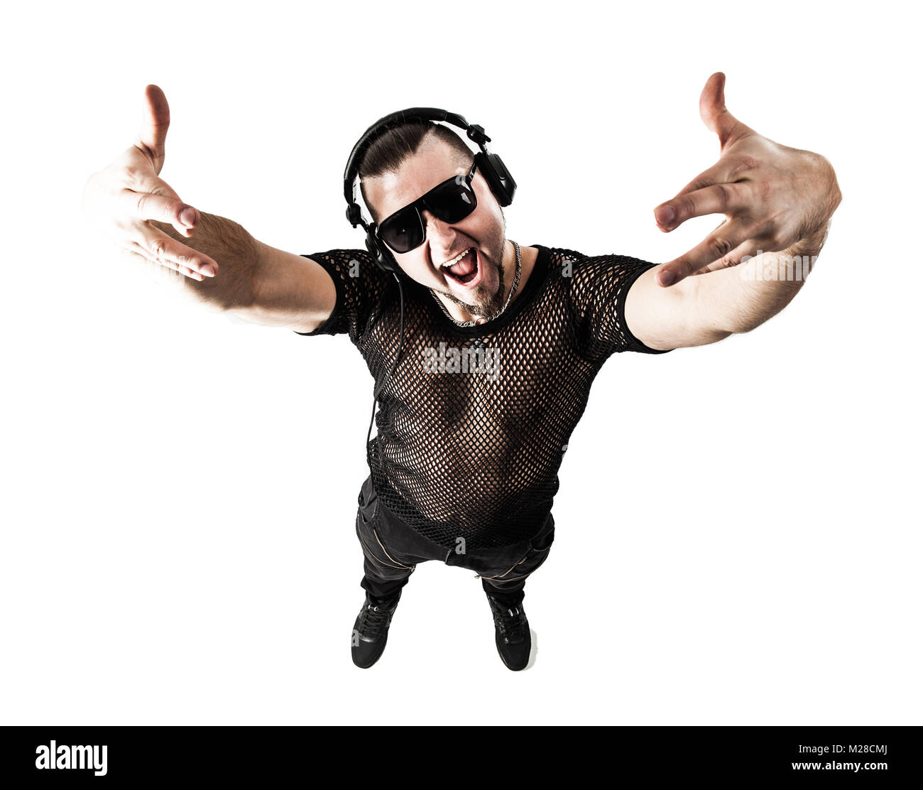 DJ - rapper in a stylish t-shirt with headphones and with hands  Stock Photo