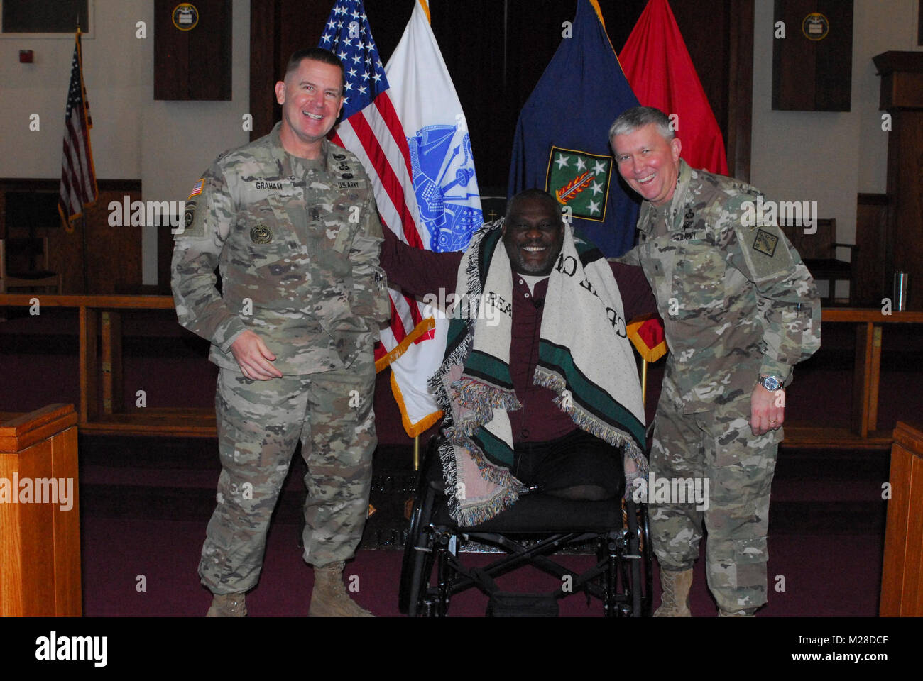 Retired Col. Gregory Gadson talked to the Soldiers of the 20th Chemical, Biological, Radiological, Nuclear, Explosives (CBRNE) Command during the monthly awards ceremony on Friday, Jan. 26 at the Aberdeen Proving Ground-Edgewood Area Chapel. Gadson spoke about the adversity he faced in May 2007 due to the traumatic injuries he received when his vehicle hit an improvised explosive device in Iraq. Now, as a double amputee, he inspired the Soldiers with an emphasis on personal resilience and faith. For his message and continuing connection to Soldiers, he was presented with the command's blanket  Stock Photo