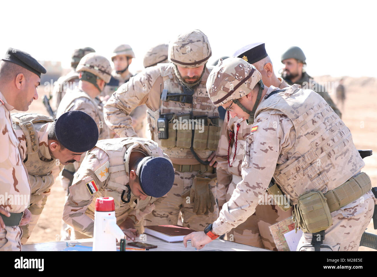 An Iraqi and Spanish army officers work with the fire direction center to prepare a live fire mission with a M198 155 mm howitzer while training with French forces at the Besmaya Range Complex, Iraq, Jan. 31, 2018.  More than 74 Coalition members have committed themselves to the goal of eliminating the threat posed by ISIS in Iraq and Syria and have contributed in various capacities to the effort. (U.S. Army Stock Photo