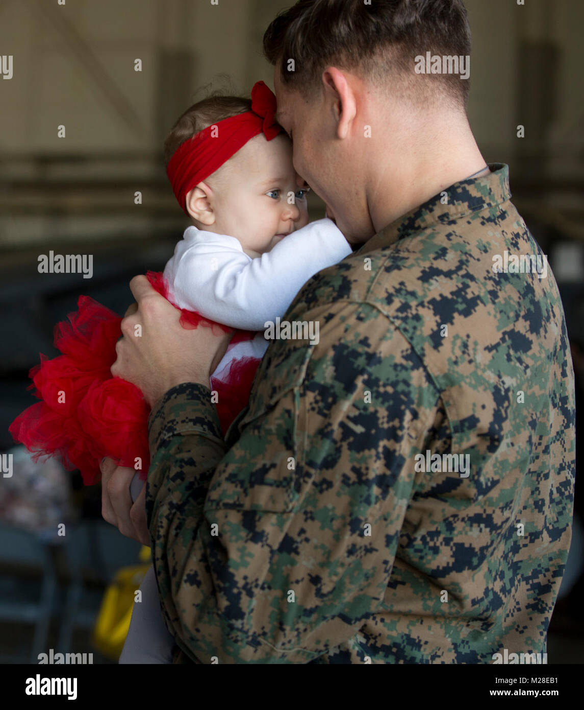 U.S. Marines with Marine Attack Squadron (VMA) 214, 3rd Marine Aircraft Wing, reunite with their friends and family in the squadron's hangar at Marine Corps Air Station Yuma, Ariz., after returing from a seven-month deployment with the 15th Marine Expeditionary Unit (MEU), Jan. 31, 2018. The Marines embarked with the 15th MEU and conducted maritime security operations and multiple military-to-military exchanges with partner nations in support of regional security, stability and the free flow of maritime commerce in the Indo-Asia-Pacific and Middle East regions. (U.S. Marine Corps Stock Photo