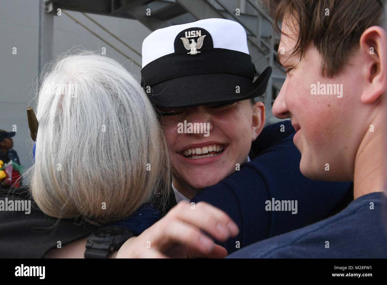 SAN DIEGO (Feb. 2, 2018) -- Hospital Corpsman Seaman Katherine Salisbury greets her family on the pier at Naval Base San Diego as the amphibious assault ship USS America (LHA 6) returns from its maiden deployment. America, part of the America Amphibious Ready Group, with embarked 15th Marine Expeditionary Unit, is returning from a regularly scheduled deployment to the Western Pacific and Middle East. The U.S. Navy has patrolled the Indo-Pacific region routinely for more than 70 years promoting peace and security. (U.S. Navy Stock Photo