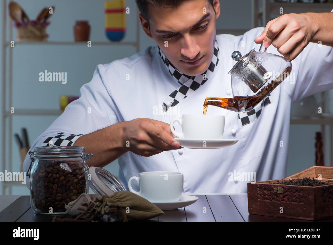 Tea expert brewing cup of drink Stock Photo Alamy