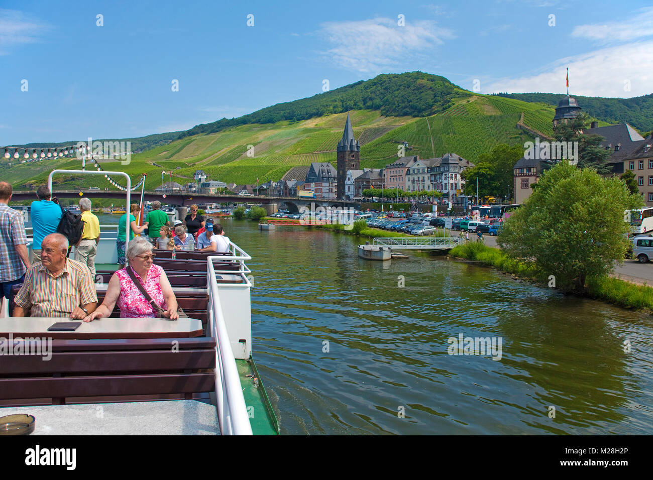 Eldery tourists on excursion ship at wine village Bernkastel-Kues, Moselle river, Rhineland-Palatinate, Germany, Europe Stock Photo
