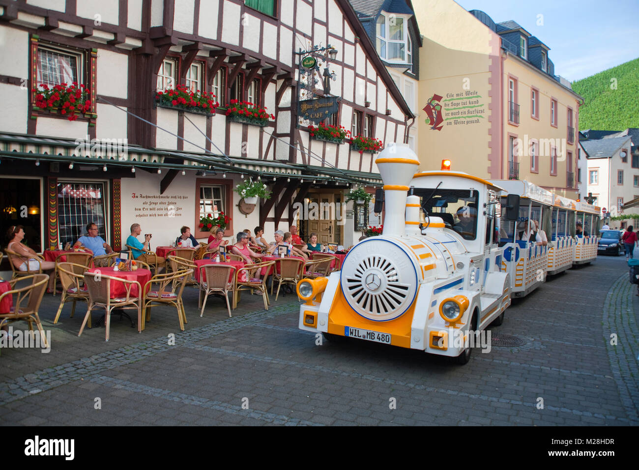 Roundtrip with a tourist vehicle, outside gastronomy, half-timbered house at the old town, Bernkastel-Kues, Moselle, Mosel river, Rhineland-Palatinate Stock Photo