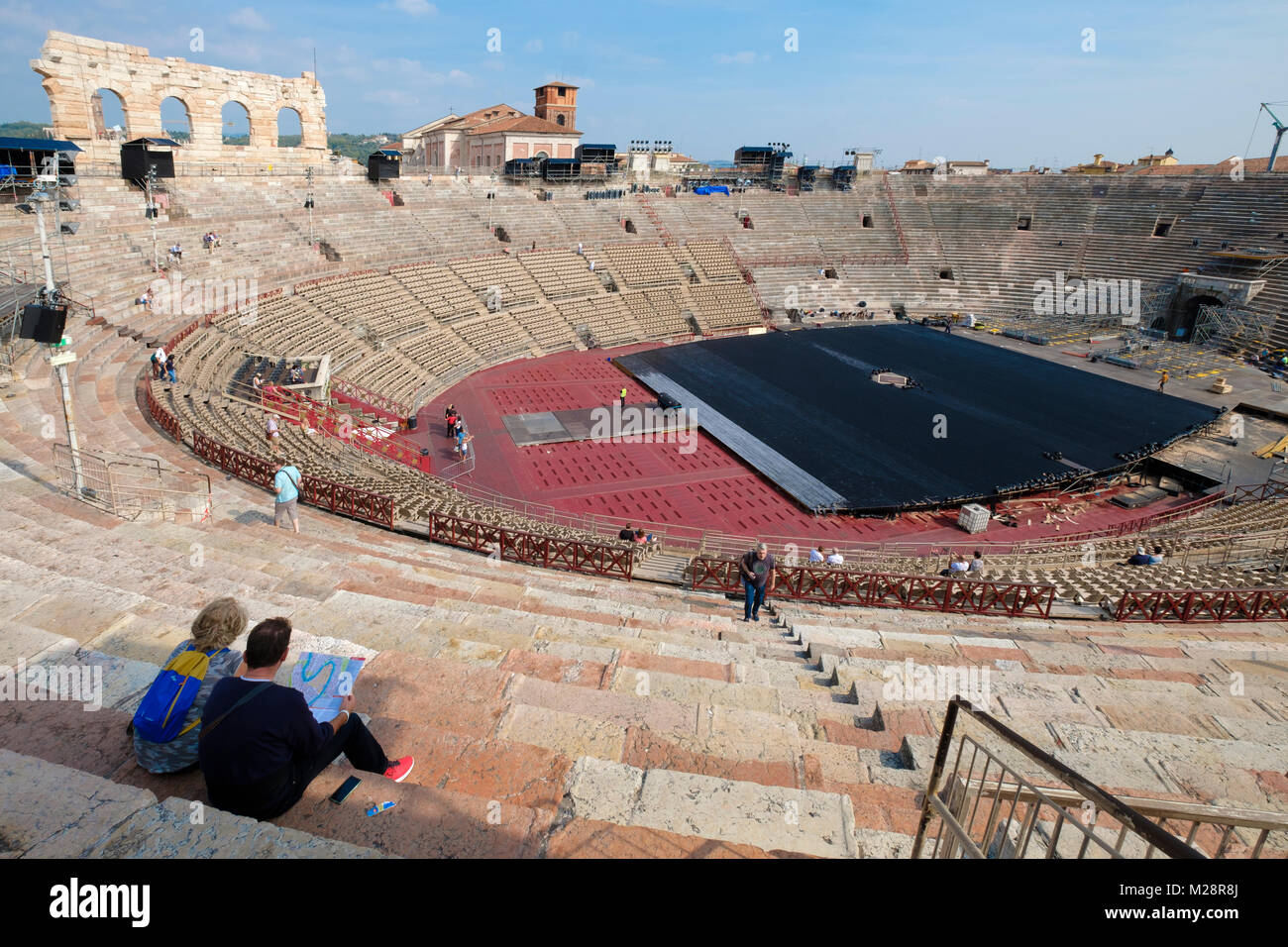 Tourists visit the Verona Arena, a former Roman amphitheatre, Piazza Bra, Verona, Veneto, Italy Stock Photo