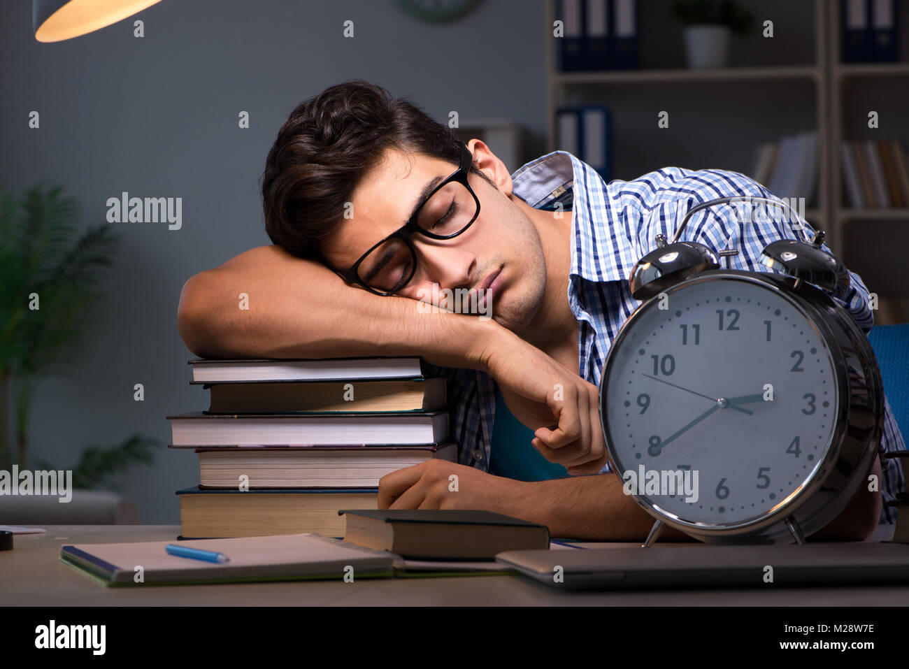 Student preparing for exams late night at home Stock Photo - Alamy