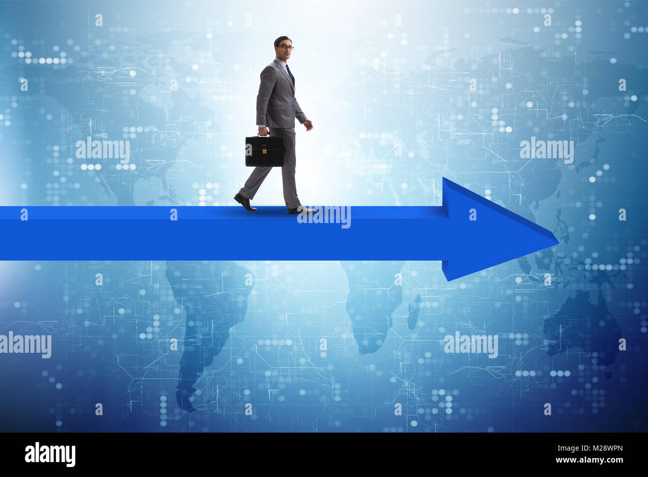 Businessman walking on arrow in business concept Stock Photo - Alamy