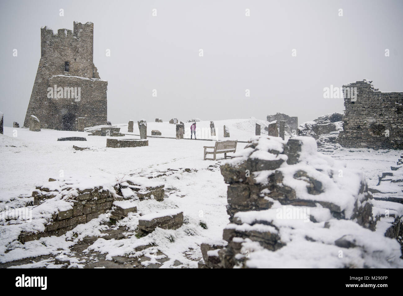 Aberystwyth, Ceredigion Wales, Tuesday 06 FebJanuary 2018 UK Weather: Heavy flurries of snow blanket Aberystwyth castle, on a cold February morning in West Wales. The Met Office has issued a ‘yellow’ warning for snow and ice, as a band of sleet and snow moves in from the west, to cover much of Wales and the north of England photo © Keith Morris / Alamy Live News Stock Photo