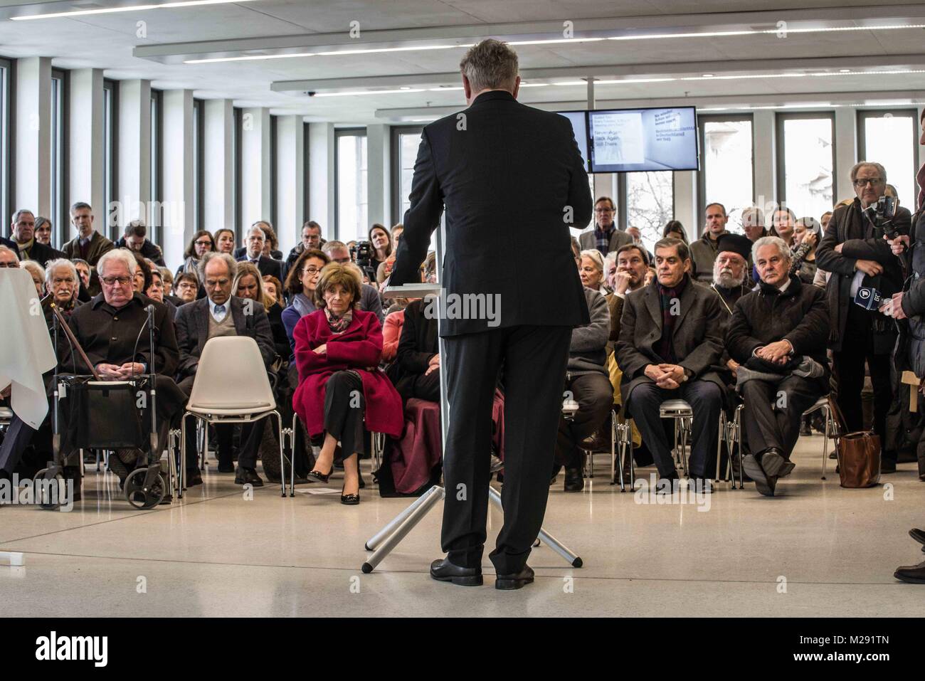 Munich, Bavaria, Germany. 6th Feb, 2018. Mayor Dieter Reiter addressing the guests, with Charlotte Knobloch in the first row. The City of Munich, Germany dedicated the plaza adjacent to the National Socialism Documentation Center (NS-Dokumentationszentrum) building to Holocaust survivor Max Mannheimer. Mannheimer was an author, painter, and prolific speaker about the experience. He and his brother were the only family members to survive. Mannheimer was born on Feb. 6, 1920 in Northern Moravia and died on Sept. 23, 2016. Among the speakers were Munich City Mayor Dieter Reiter, Sister E Credit:  Stock Photo