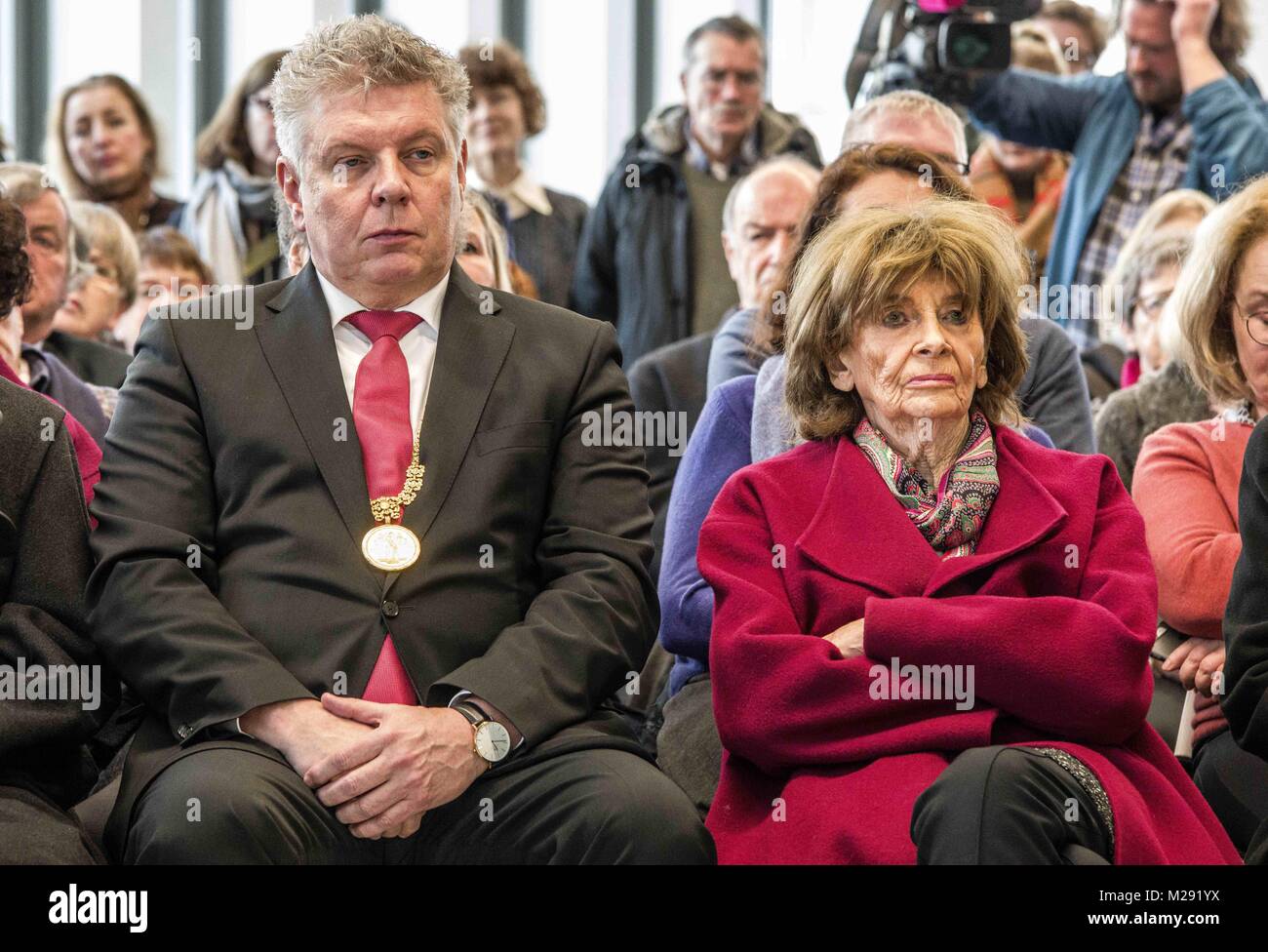 Munich, Bavaria, Germany. 6th Feb, 2018. Munich Mayor Dieter Reiter seated next to Holocaust survivor Charlotte Knoblauch. The City of Munich, Germany dedicated the plaza adjacent to the National Socialism Documentation Center (NS-Dokumentationszentrum) building to Holocaust survivor Max Mannheimer. Mannheimer was an author, painter, and prolific speaker about the experience. He and his brother were the only family members to survive. Credit: ZUMA Press, Inc./Alamy Live News Stock Photo