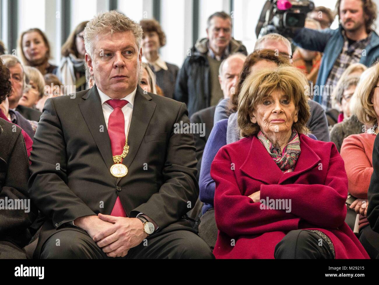 Munich, Bavaria, Germany. 6th Feb, 2018. Munich Mayor Dieter Reiter seated next to Holocaust survivor Charlotte Knoblauch. The City of Munich, Germany dedicated the plaza adjacent to the National Socialism Documentation Center (NS-Dokumentationszentrum) building to Holocaust survivor Max Mannheimer. Mannheimer was an author, painter, and prolific speaker about the experience. He and his brother were the only family members to survive. Credit: ZUMA Press, Inc./Alamy Live News Stock Photo