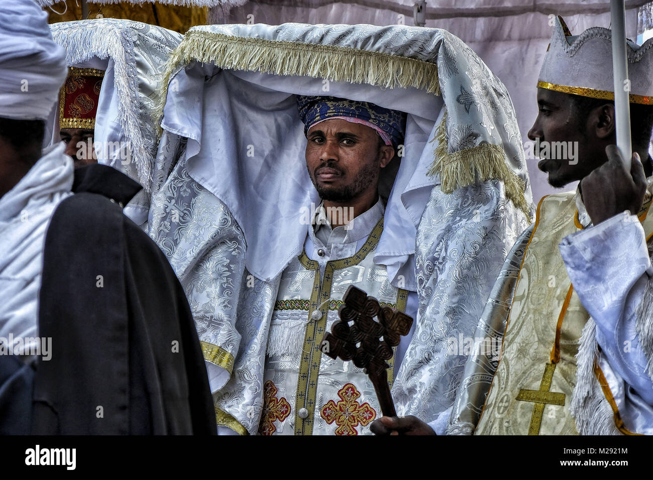 January 18, 2018 - Gondar, Amhara Region, Ethiopia - Orthodox priests carry a tabot, a model of the Ark of the Covenant, on a procession through Gondar..The annual Timkat festival, an Orthodox Christian celebration of Epiphany, remembers the baptism of Jesus in the Jordan river. During the festival, tabots, models of the Ark of the Covenant, are taken from churches around the city of Gondar and paraded through the streets to Fasilides Bath. Where finally the pilgrims end up bathing in the water blessed by the priests. (Credit Image: © Oscar Espinosa/SOPA via ZUMA Wire) Stock Photo