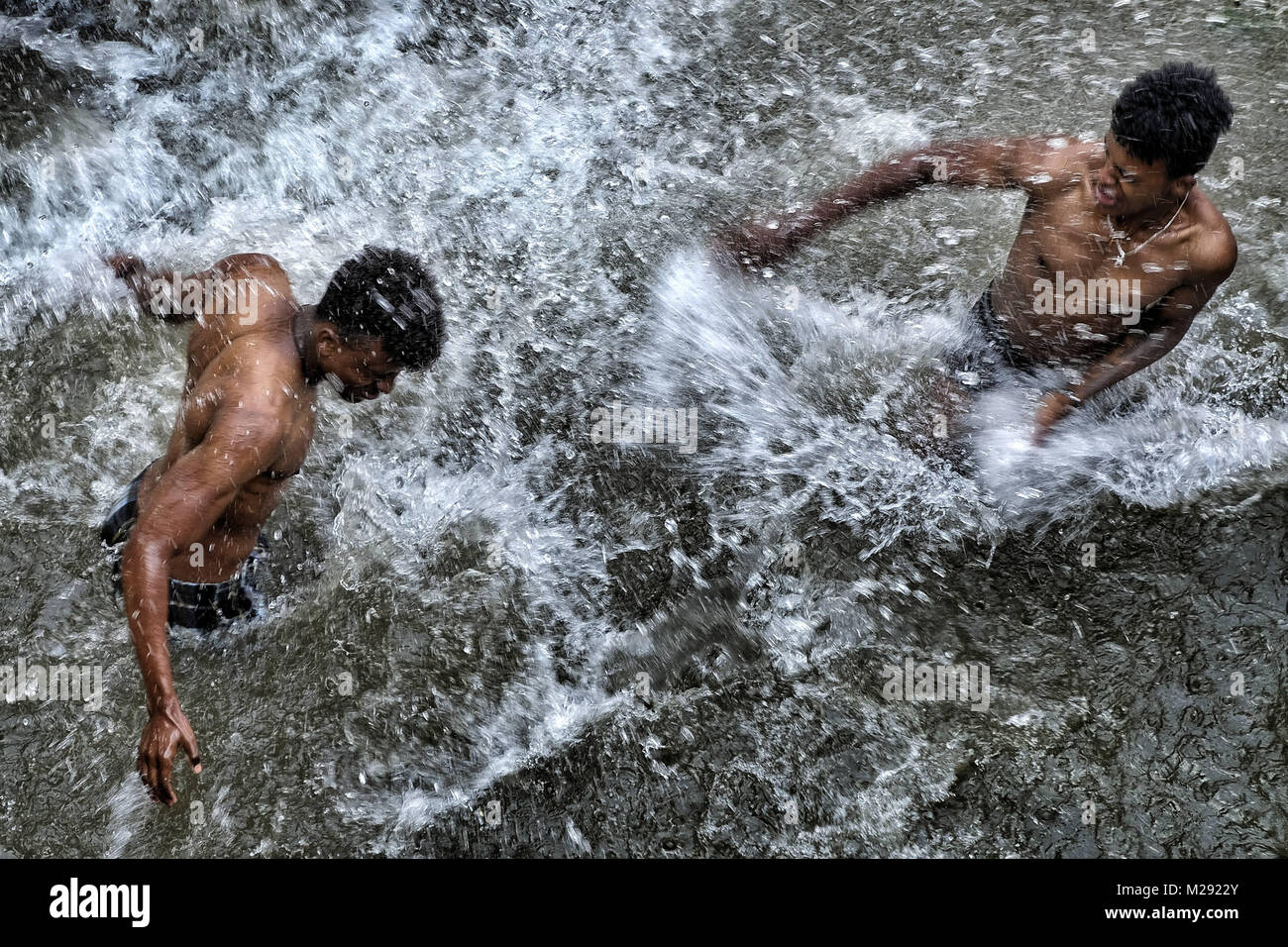January 19, 2018 - Gondar, Amhara Region, Ethiopia - Pilgrims bathing in the blessed waters of the Fasilides Baths..The annual Timkat festival, an Orthodox Christian celebration of Epiphany, remembers the baptism of Jesus in the Jordan river. During the festival, tabots, models of the Ark of the Covenant, are taken from churches around the city of Gondar and paraded through the streets to Fasilides Bath. Where finally the pilgrims end up bathing in the water blessed by the priests. (Credit Image: © Oscar Espinosa/SOPA via ZUMA Wire) Stock Photo