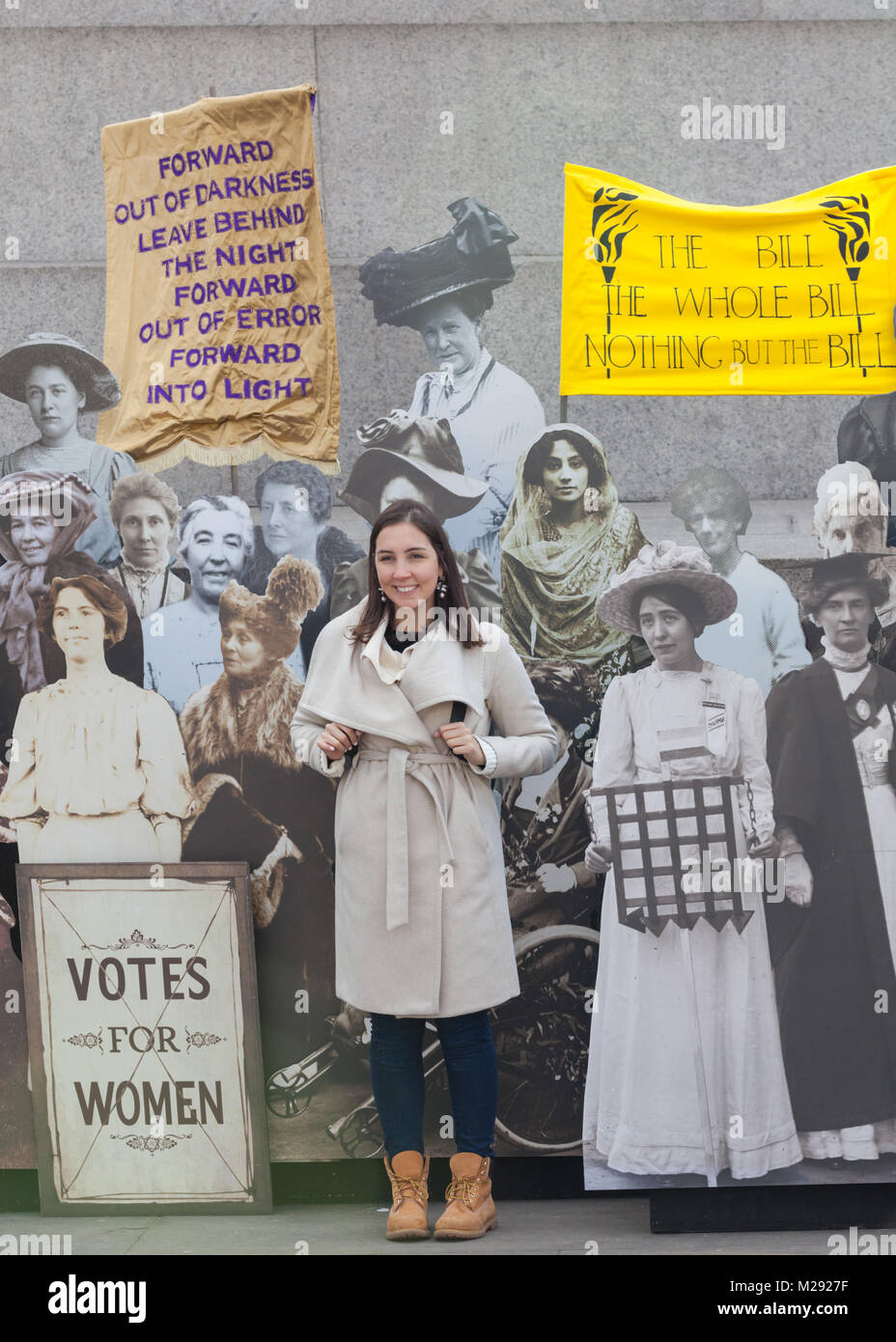 Trafalgar Square, London, 6th Feb 2018. Tourists and Londoners interact with the exhibition A collection of life-size images of of the suffragettes form a public exhibition on Trafalgar Square, part of Mayor of London Sadiq Khan’s campaign celebrating women’s contributions to the capital and the centenary of women’s suffrage. Credit: Imageplotter News and Sports/Alamy Live News Stock Photo