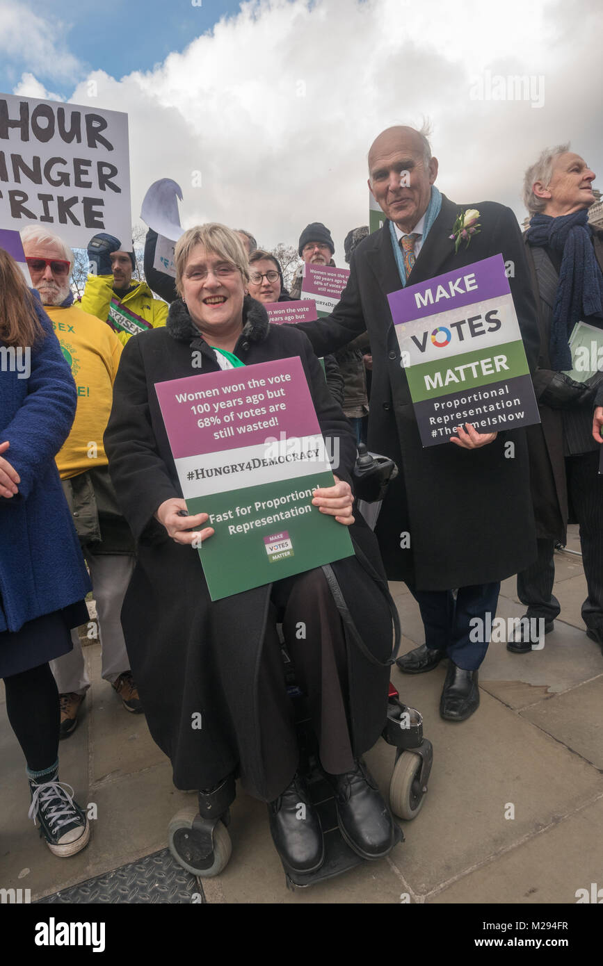 London, UK. 5 February 2018.  Baroness Sal Brinton, Vince Cable and other campaigners pose in Parliament Square as hundreds of fair vote campaigners take part in a 24 hour hunger strike organised by Make Votes Matter (MVM) in protest against our dysfunctional electoral system and to urge Proportional Representation.  The event took place on the centenary of the 1918 the Representation of the People Act when for the first time some women and all men over 21 in the UK gained the right to vote. MVM point out that although now everyone can vote, for over two thirds of us our vote has no effect on  Stock Photo