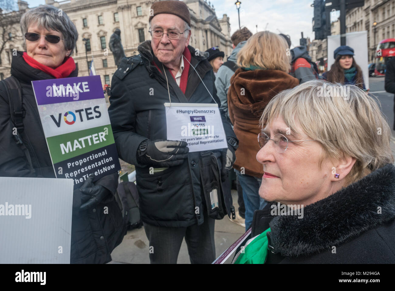 London, UK. 5 February 2018.  Campaigners pose in Parliament Square as hundreds of fair vote campaigners take part in a 24 hour hunger strike organised by Make Votes Matter (MVM) in protest against our dysfunctional electoral system and to urge Proportional Representation.  The event took place on the centenary of the 1918 the Representation of the People Act when for the first time some women and all men over 21 in the UK gained the right to vote. Credit: Peter Marshall/Alamy Live News Stock Photo