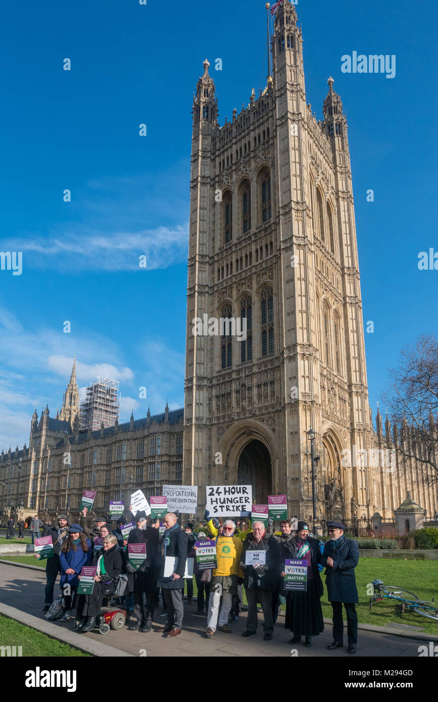 London, UK. 5 February 2018.  Campaigners pose on College Green as hundreds of fair vote campaigners take part in a 24 hour hunger strike organised by Make Votes Matter (MVM) in protest against our dysfunctional electoral system and to urge Proportional Representation.  The event took place on the centenary of the 1918 the Representation of the People Act when for the first time some women and all men over 21 in the UK gained the right to vote. es o Credit: Peter Marshall/Alamy Live News Stock Photo