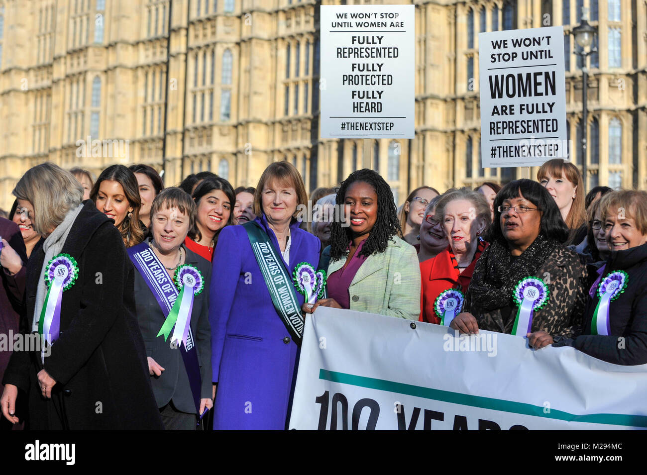 London, UK.  6 February 2018. (C) Harriet Harman, Dawn Butler, Margaret Beckett and Diane Abbott join female members of the Shadow Cabinet and Labour politicians outside the Houses of Parliament, wearing Labour styled suffragette rosettes, holding placards next to a ‘100 Years of Women Voting’ banner to help launch Labour's campaign to celebrate 100 years of women’s suffrage.  Credit: Stephen Chung / Alamy Live News Stock Photo