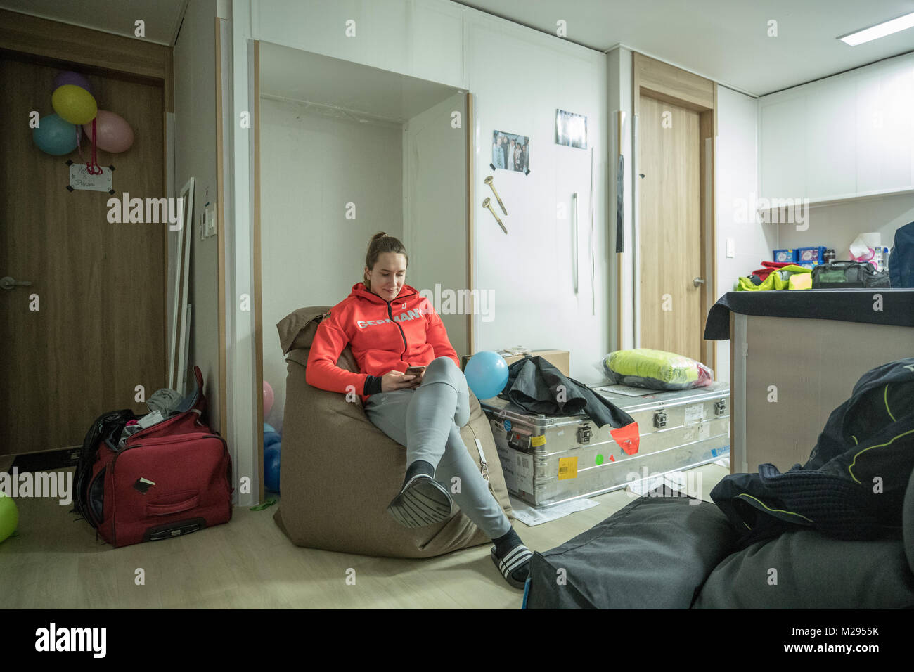 Pyeongchang, South Korea. 6th Feb, 2018. Jacqueline Loelling, skeleton athelete from Germany, sitting in her accomodation in the Olympic village in Pyeongchang, South Korea, 06 Febuary 2018. Credit: dpa picture alliance/Alamy Live News Stock Photo