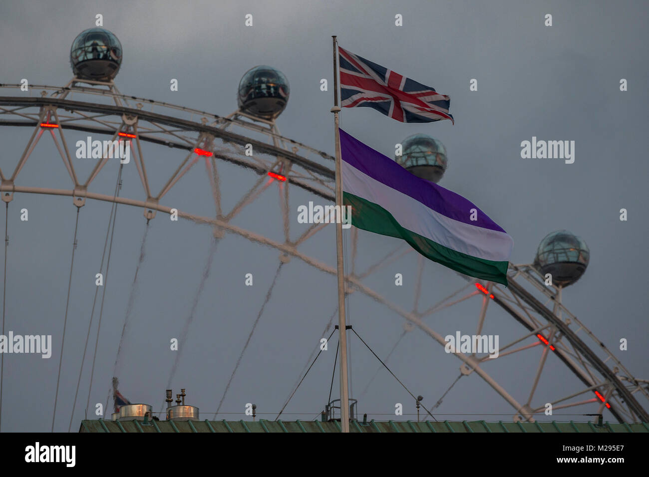 London, UK. 6th Feb, 2018. The Suffrage flag flies over Whitehall at the back of Downing Street. It coincides with the 100 year anniversary of the 1918 Representation of the People Act, which gave some women the vote, and was introduced thanks to the campaigning of suffragists and suffragettes. Credit: Guy Bell/Alamy Live News Stock Photo