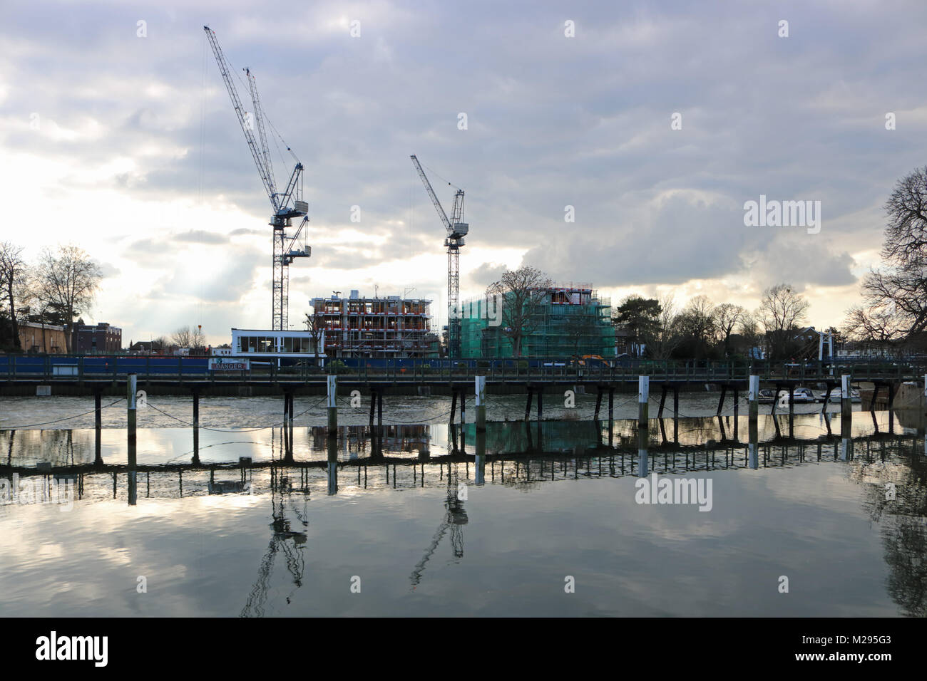 Teddington, London, UK. 6th Feb, 2018. UK Weather. Construction of new housing development on the old Thames Studio site at Teddington, on a bitterly cold day beside the River Thames where the temperature only reached 3 degrees. Credit: Julia Gavin/Alamy Live News Stock Photo