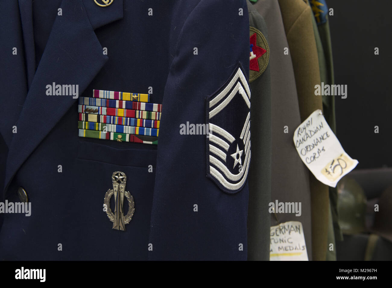 Dalton, GA, USA. 4th Feb, 2018. Military memorabilia and relics collectors gathered at Dalton Georgia exhibition center to buy, sell, trade swords, muskets, bullets and uniforms from 1800s to the Vietnam era. Military enthusiasts often spend thousands of dollars on their collections. Pictured: U.S. Air Force uniform for sale, including ribbons Credit: Robin Rayne Nelson/ZUMA Wire/Alamy Live News Stock Photo