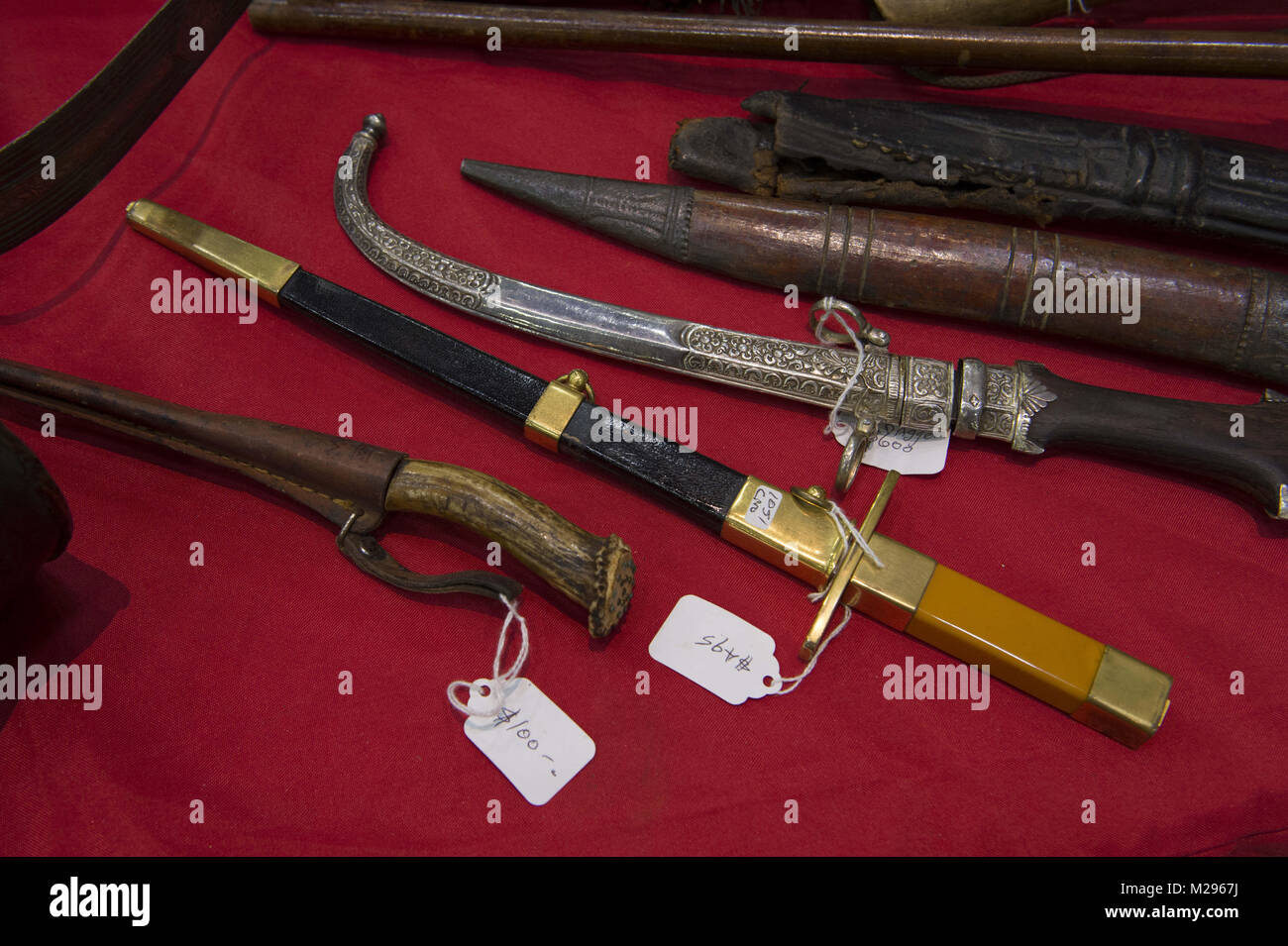 Dalton, GA, USA. 4th Feb, 2018. Military memorabilia and relics collectors gathered at Dalton Georgia exhibition center to buy, sell, trade swords, muskets, bullets and uniforms from 1800s to the Vietnam era. Military enthusiasts often spend thousands of dollars on their collections. Pictured: various daggers for sale Credit: Robin Rayne Nelson/ZUMA Wire/Alamy Live News Stock Photo