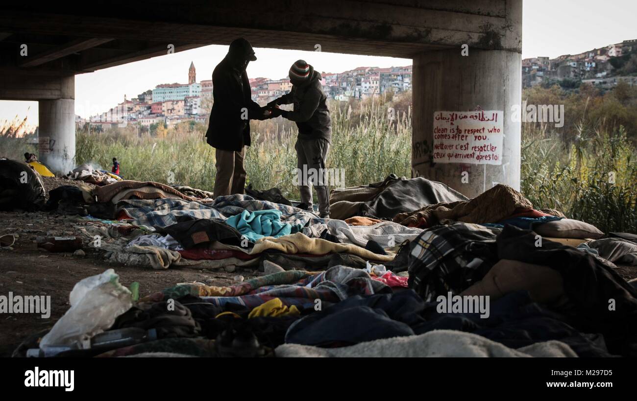 Ventimiglia, Imperia, Italy. 13th Dec, 2017. Two men from Darfur, Sudan beneath an underpass in the Italian town of Ventimiglia. Migrants and refugees are sleeping rough beneath the underpass and using the town as a base from which to attempt a crossing into nearby France. Most efforts end in failure.Italy is a country hit hard by the European refugee/migrant crisis. Unlike Greece where most of the migrants are from the war torn middle east, most of the migrants in Italy are from African nations heading to Europe for economical reasons. Credit: John Owens/SOPA/ZUMA Wire/Alamy Live News Stock Photo