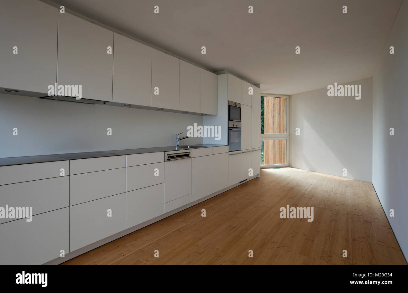 Modern kitchen, wooden floor Stock Photo - Alamy