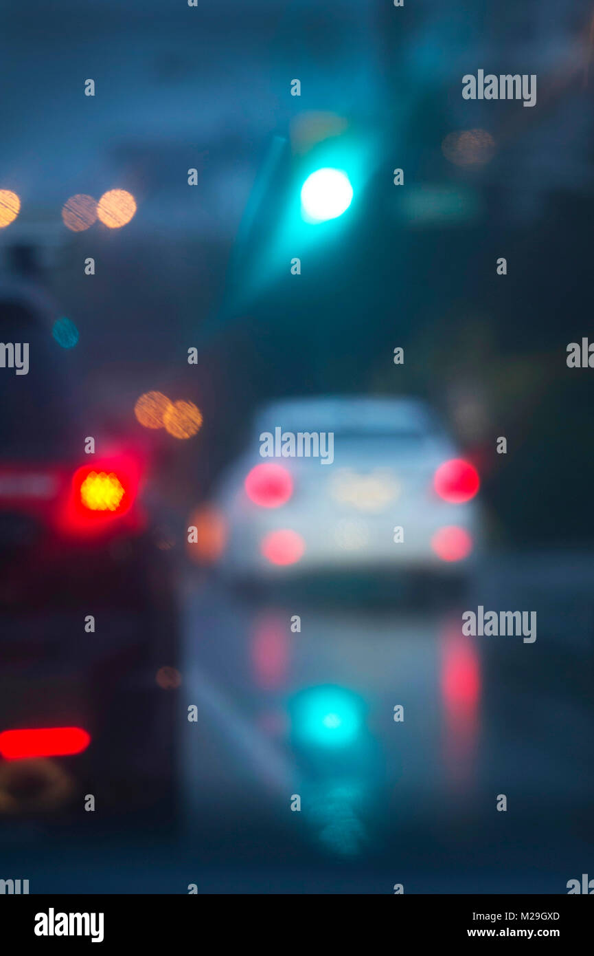 Blurred image of a car driving in the rain at night Stock Photo - Alamy