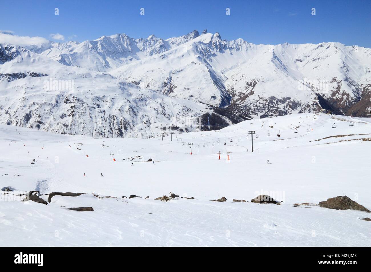 Snowy mountains and ski lifts in Alps of France. Galibier-Thabor ...