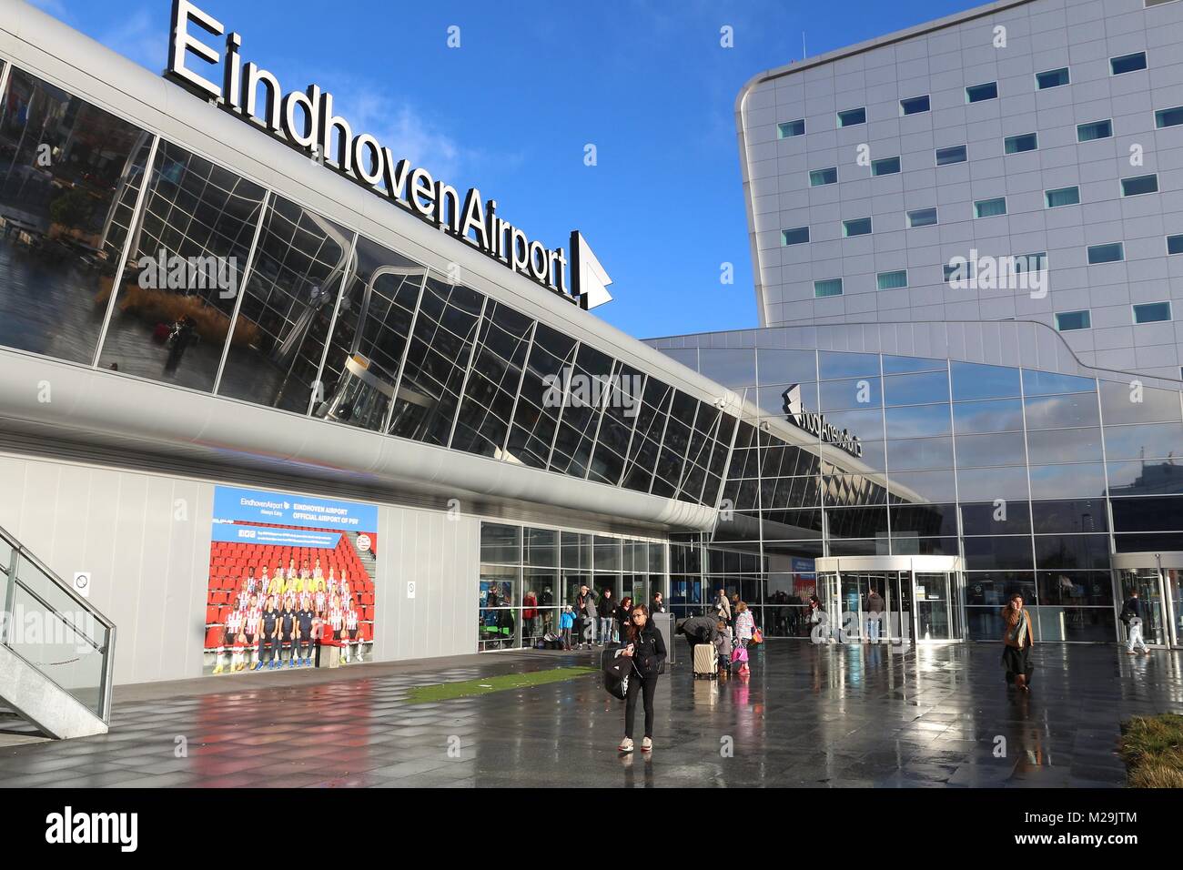 EINDHOVEN, NETHERLANDS - NOVEMBER 19, 2016: People exit Eindhoven Airport in the Netherlands. It is the 2nd largest airport in the Netherlands, with 4 Stock Photo