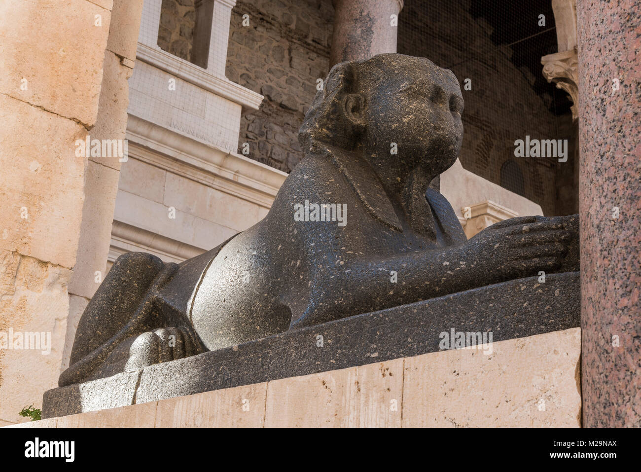 The black granite sphinx guarding the entrance of the Temple of Jupiter in the Palace of Diocletian, Split, Dalmatia, Croatia Stock Photo