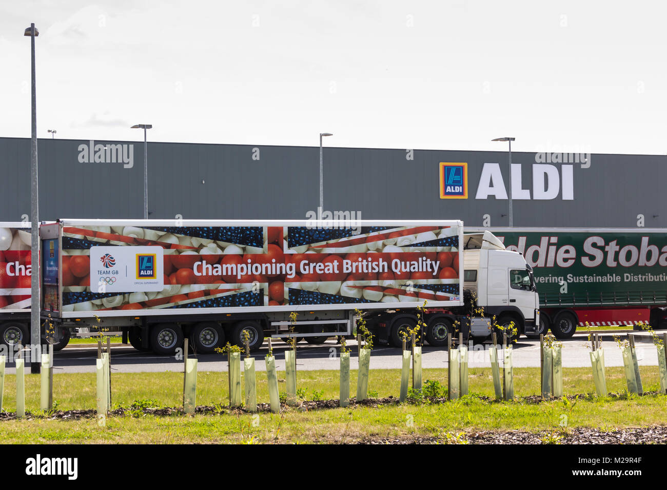 Aldi and Eddie Stobart branded articulated lorries outside the new Aldi Distribution warehouse at Logistics North, Over Hulton, Bolton. Stock Photo