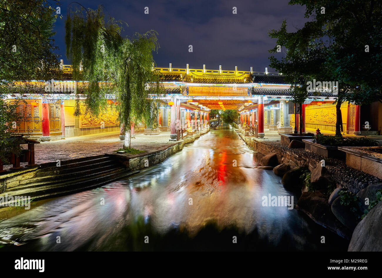 Bridge in old town of Lijiang at night. This historical center, also known as Dayan, was registered on the UNESCO World Heritage List in 1997, China. Stock Photo