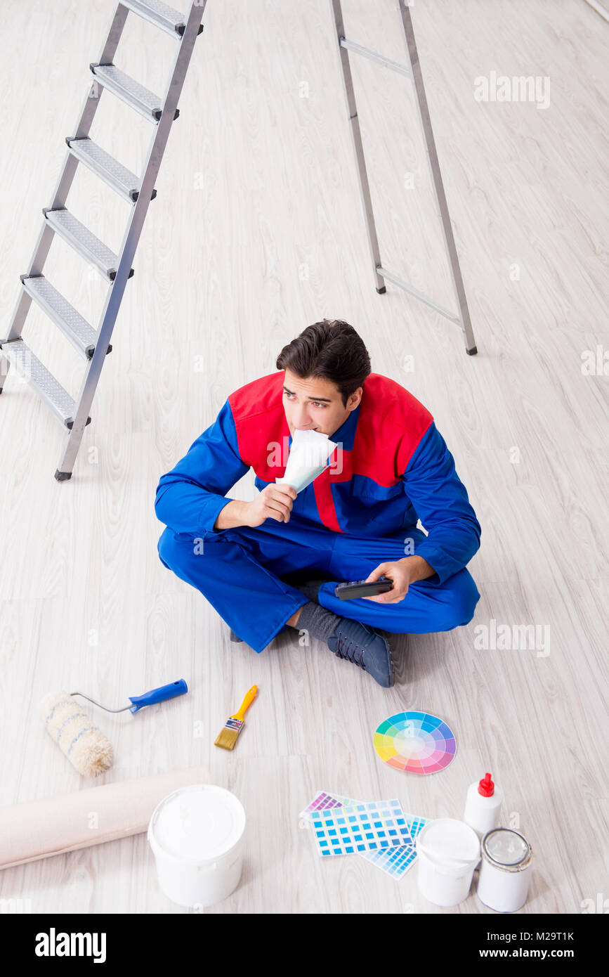 Young painter trying to match colours for painting job Stock Photo Alamy