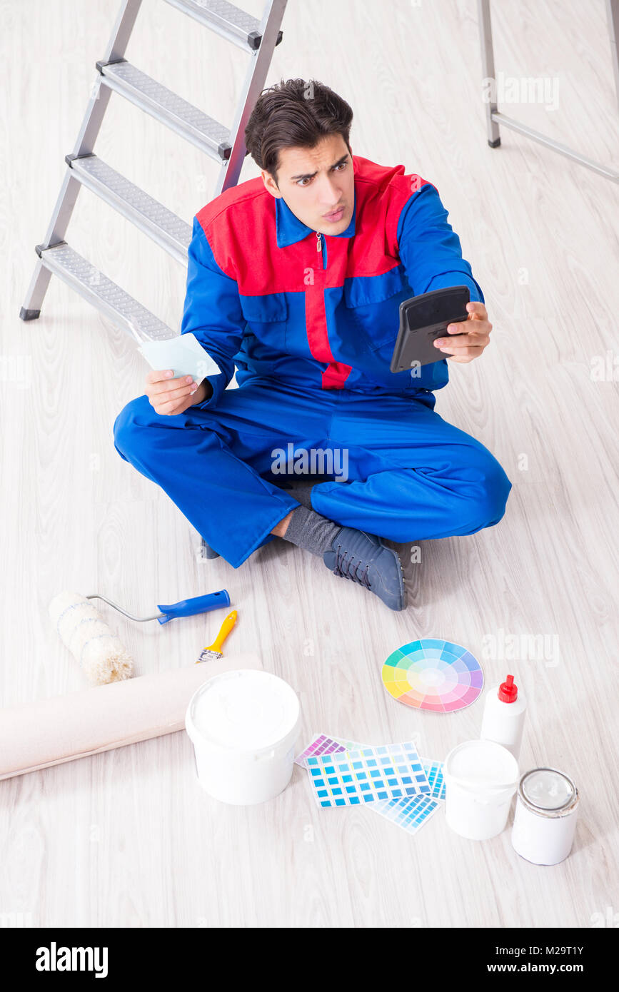 Young painter trying to match colours for painting job Stock Photo Alamy