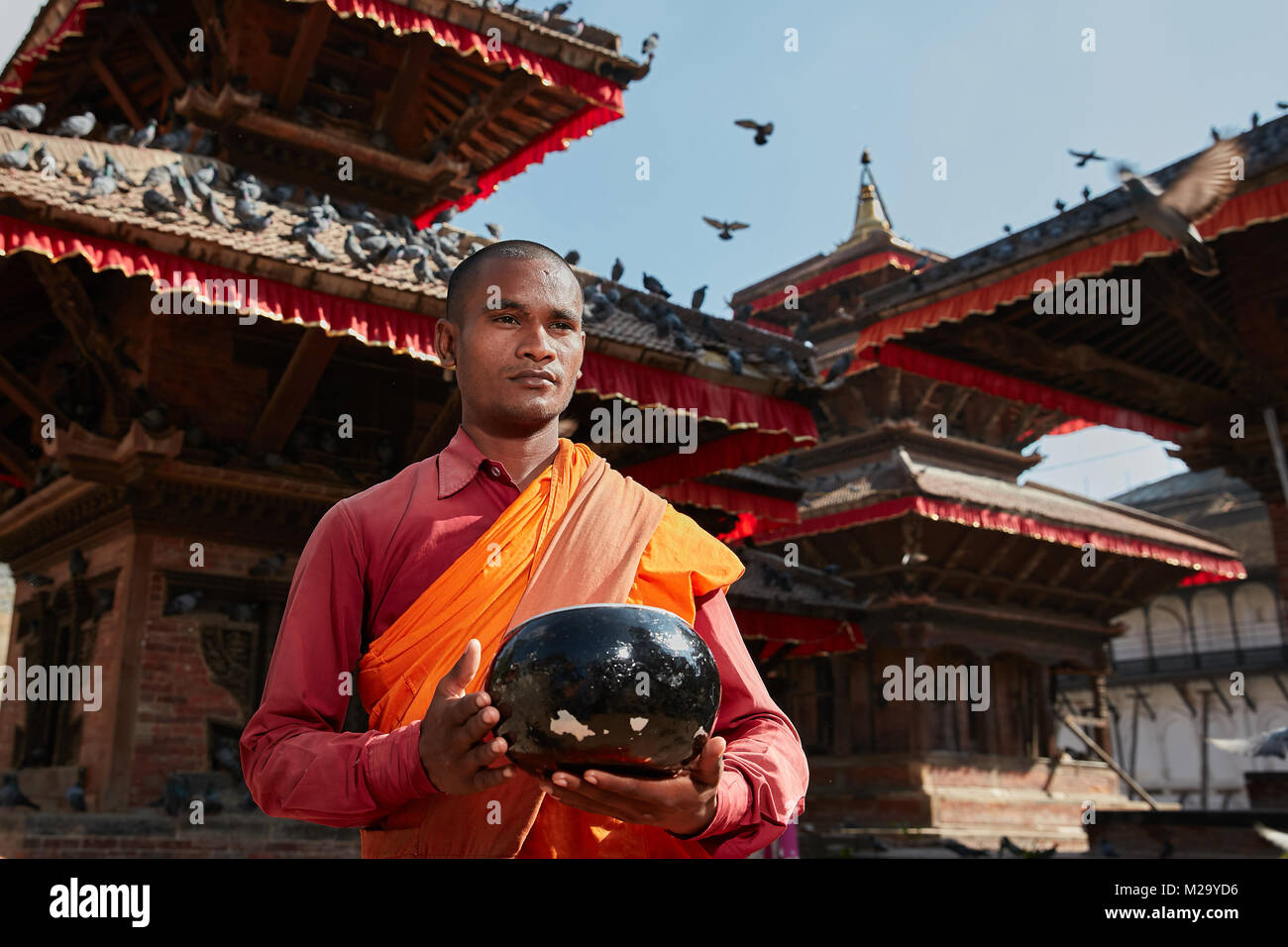 Monk wearing orange robe hires stock photography and images Alamy