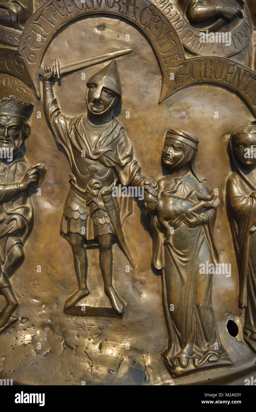 Massacre of the Innocents. Romanesque relief on the cover of the bronze baptismal font (Bronzetaufe) from the 11th century in the Hildesheim Cathedral (Hildesheimer Dom) in Hildesheim in Lower Saxony, Germany. Stock Photo