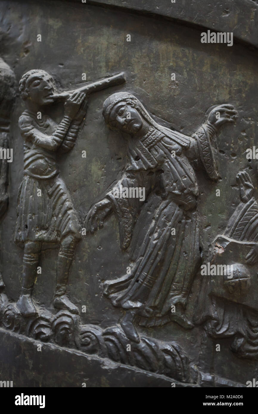 Dance of Salome. Romanesque bronze relief on the Bernward Column (Bernwardssäule), also known as the Christ Column (Christussäule) in the Hildesheim Cathedral (Hildesheimer Dom) in Hildesheim in Lower Saxony, Germany. Stock Photo
