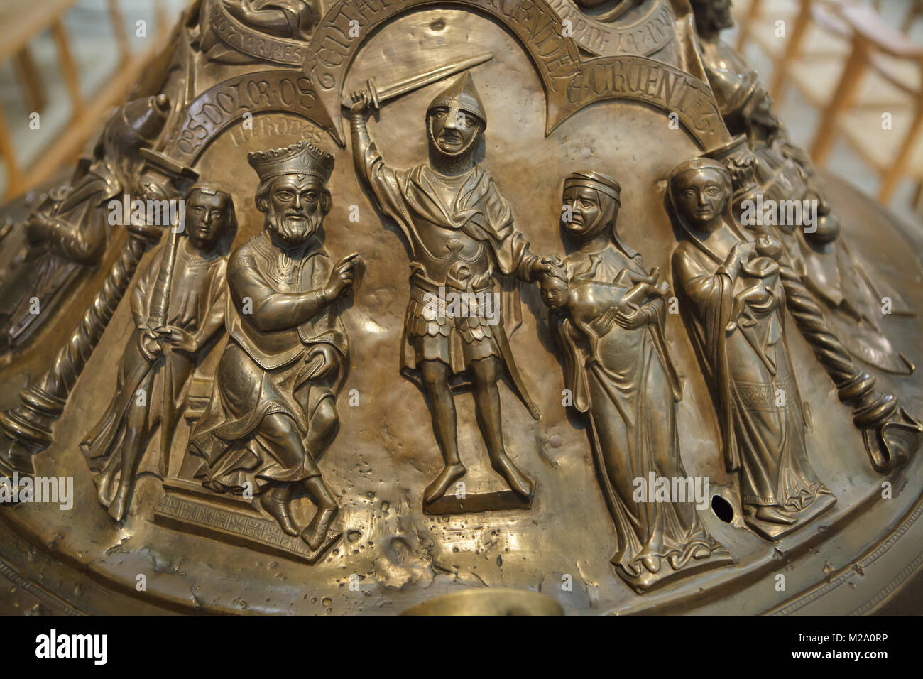 Massacre of the Innocents. Romanesque relief on the cover of the bronze baptismal font (Bronzetaufe) from the 11th century in the Hildesheim Cathedral (Hildesheimer Dom) in Hildesheim in Lower Saxony, Germany. Stock Photo