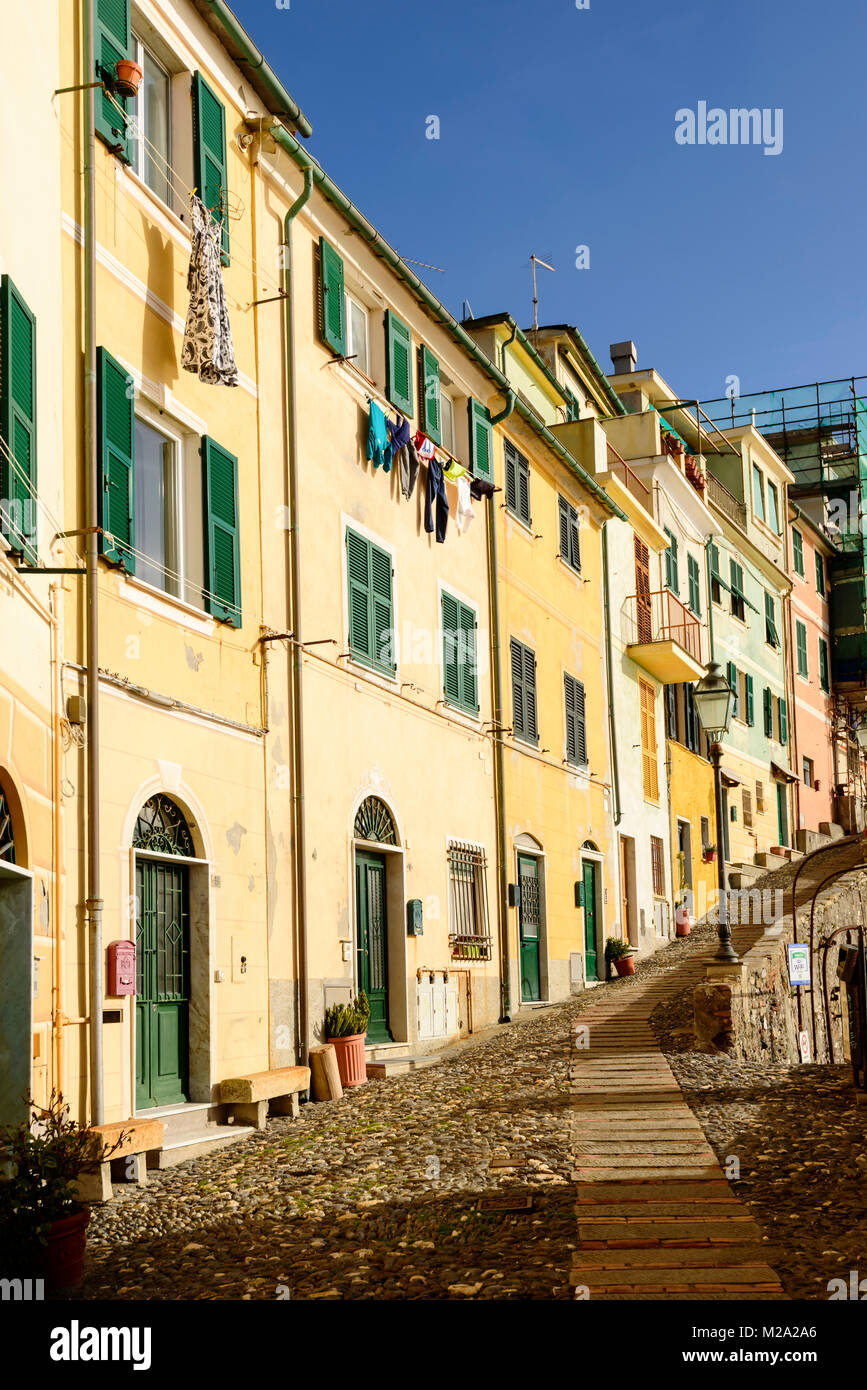 historical traditional houses on steep cobbled lane, shot  on a sunny winter day at Bogliasco, Genova, Italy Stock Photo