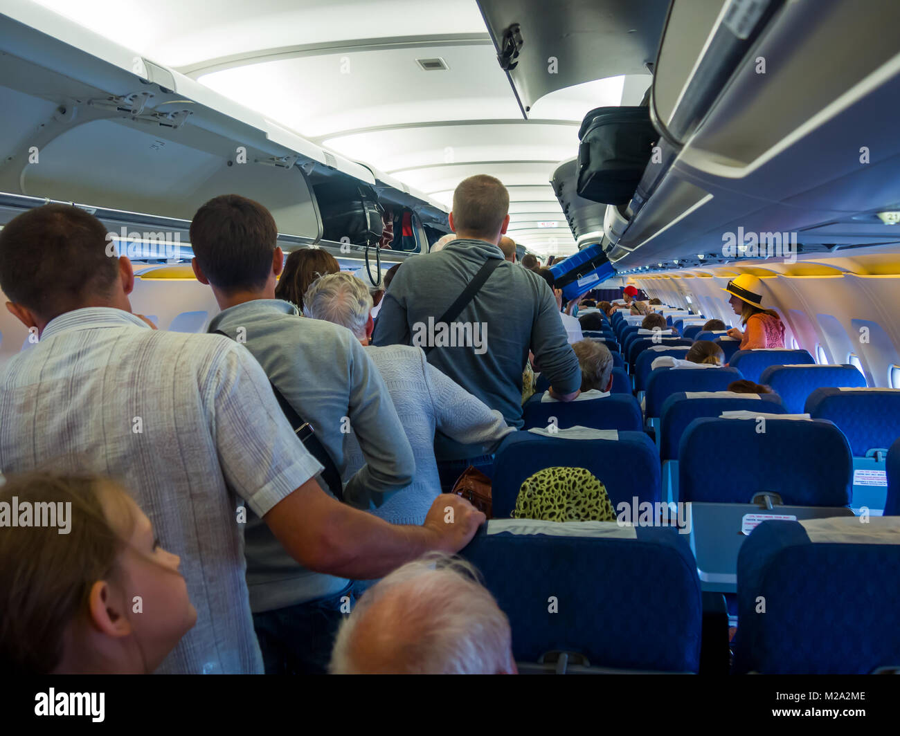 Simferopol, Russia - June 15, 2016: Passengers expect exit the aircraft after landing Stock Photo