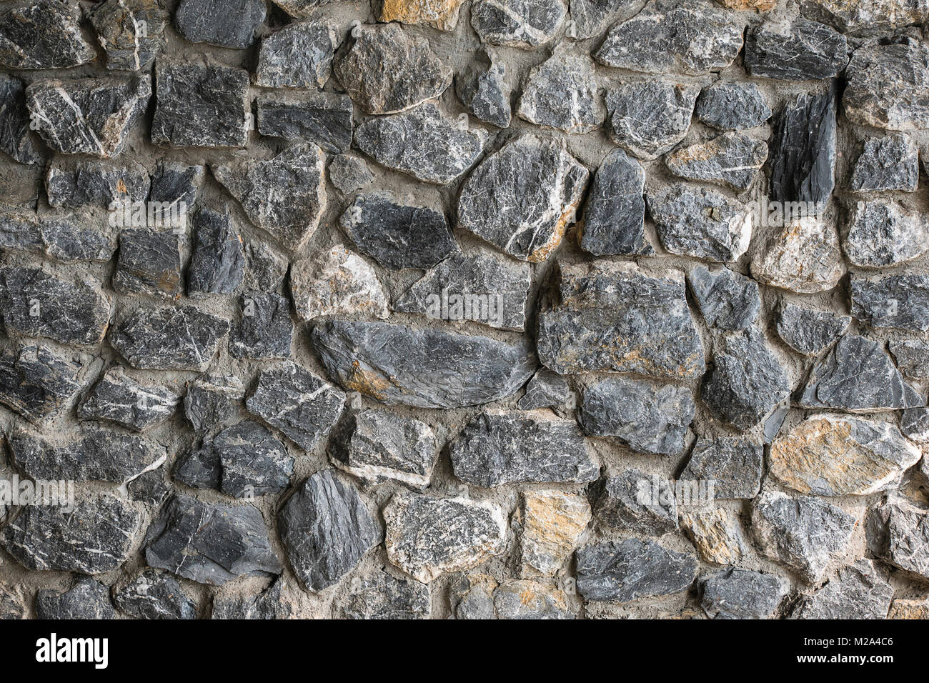 Rock wall texture background ,wall of natural decorative stone Stock Photo