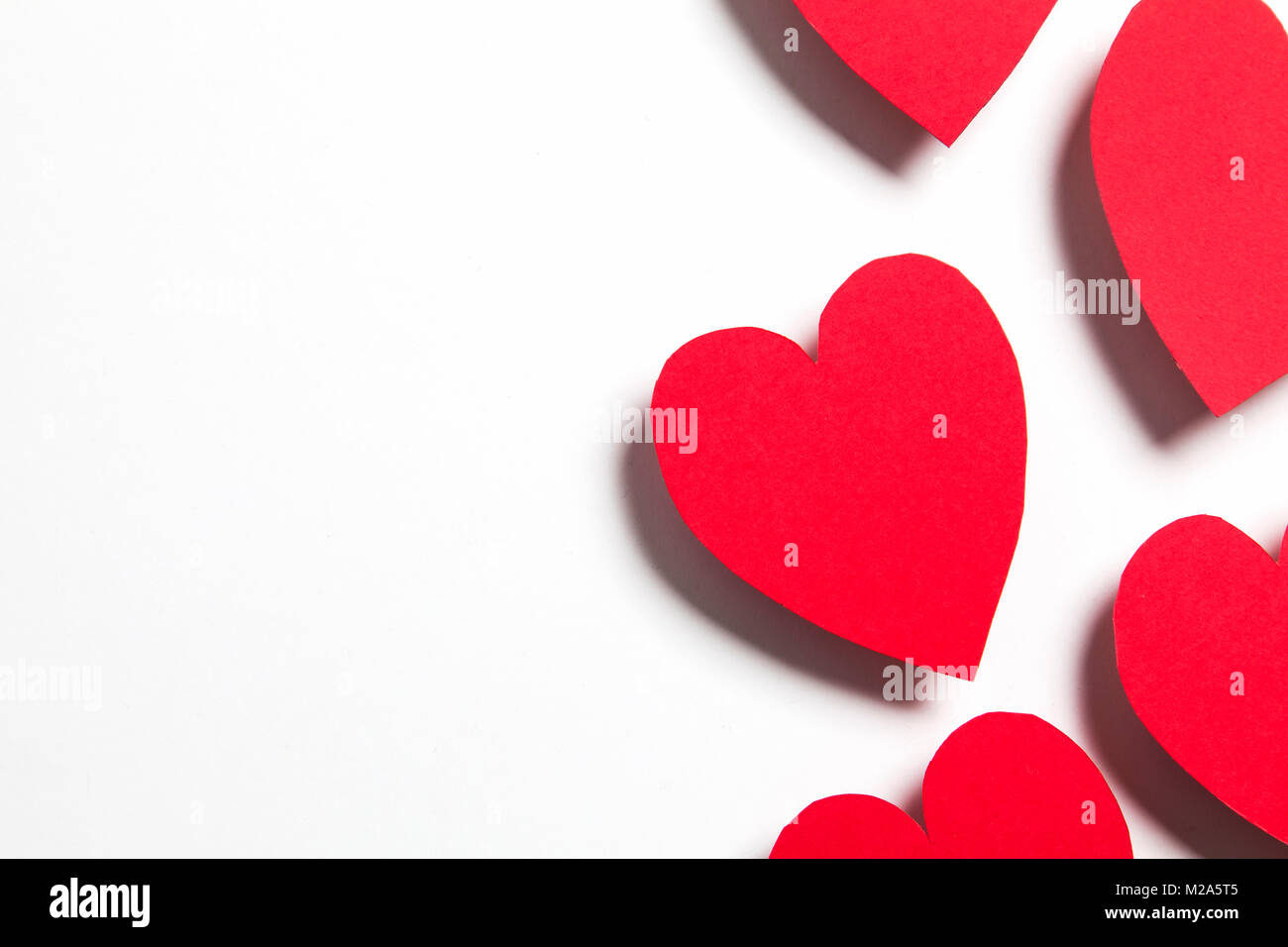 Red handmade paper hearts on a white background Stock Photo - Alamy
