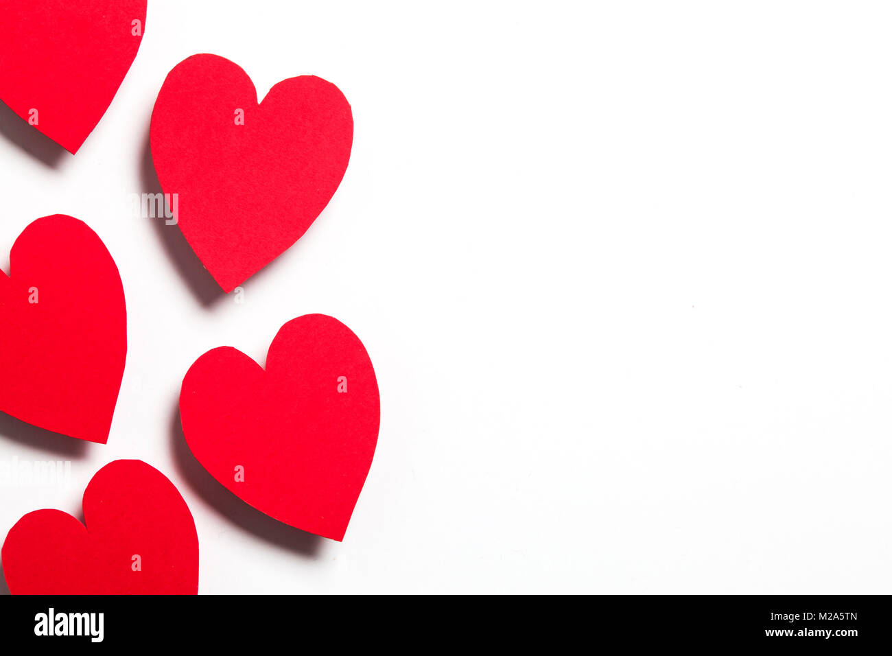 Red handmade paper hearts on a white background Stock Photo - Alamy