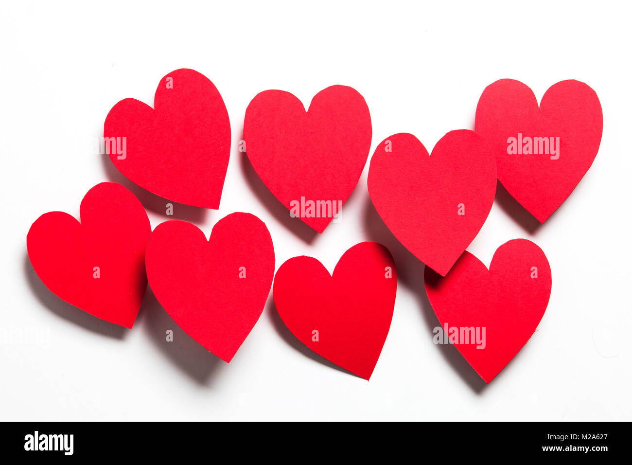 Red handmade paper hearts on a white background Stock Photo - Alamy